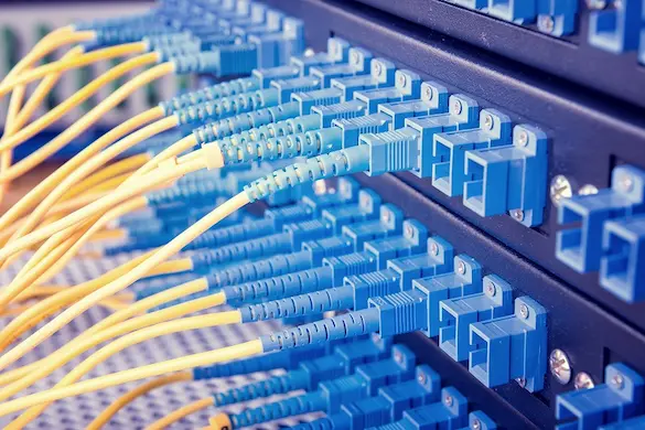 Numerous optical fiber wires mounted into patch panel for system and network integration services