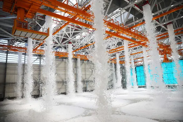 Active fire suppression system with multiple foam generators in a large hangar