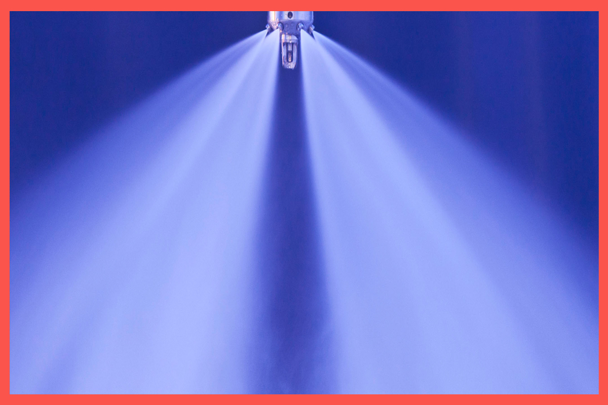 Active Fogtec water mist nozzle in use for fire suppression