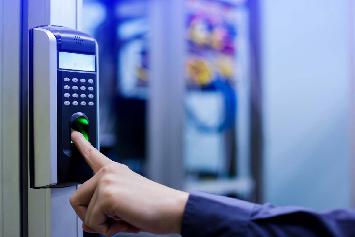 Scanning fingerprint on access control system with fingerprint, and keypad for pin code to gain secure entry into a restricted area