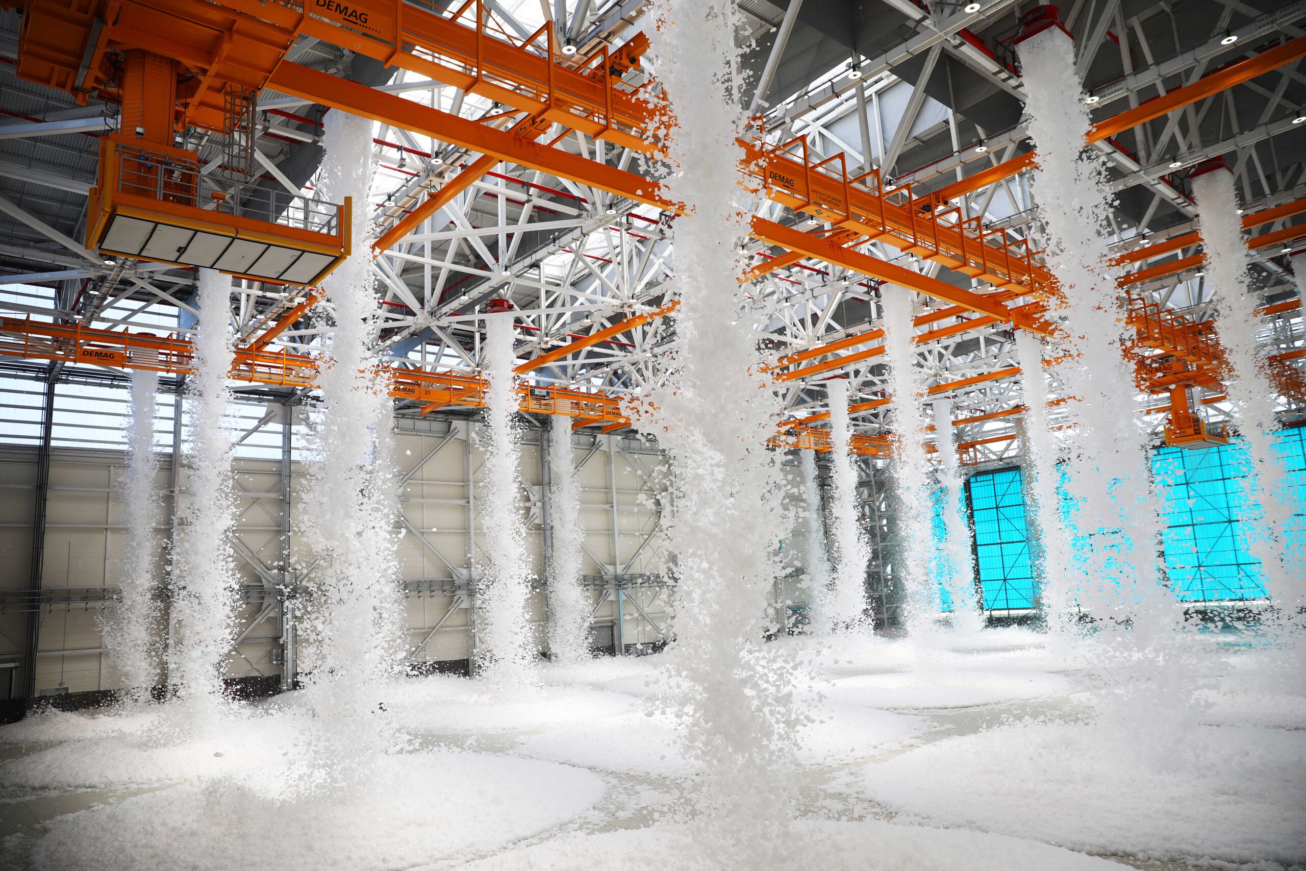 Active fire suppression system with multiple foam generators in a large hangar