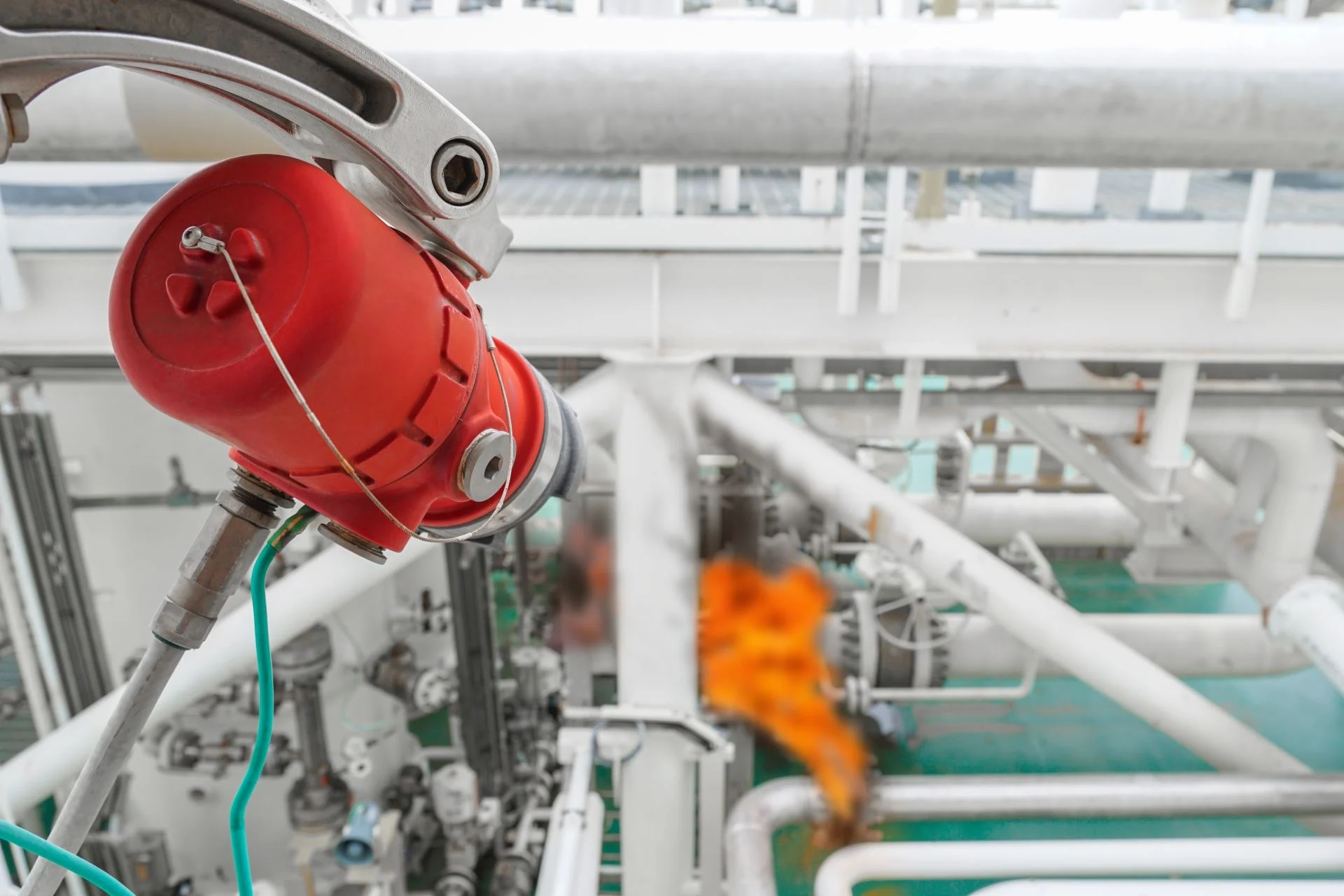 Flame detector installed in an industrial factory setting