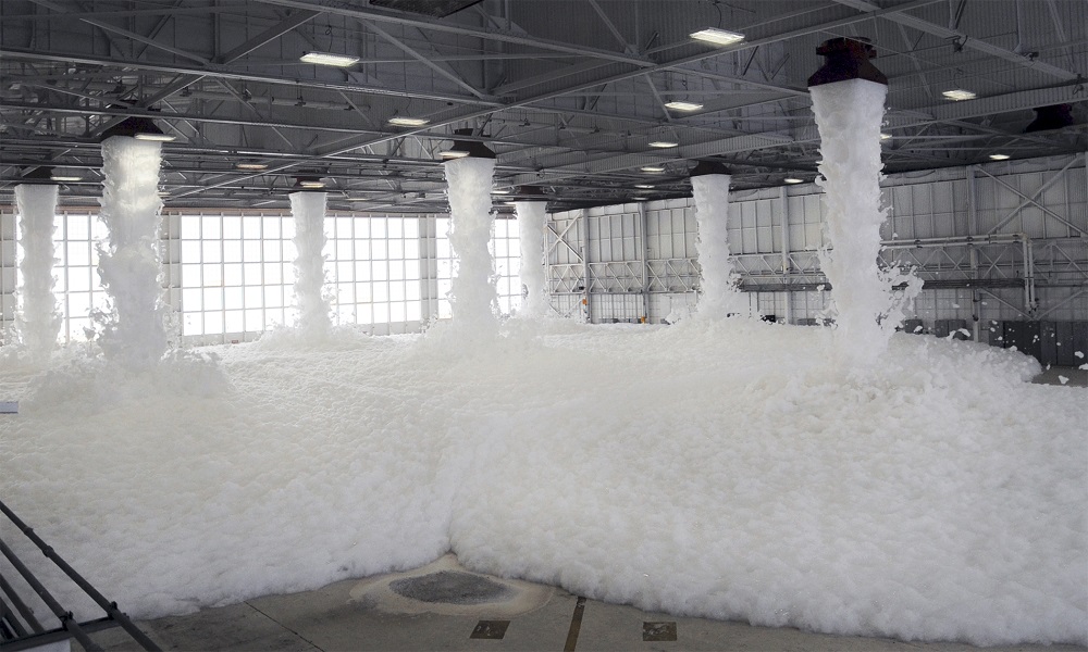 Active foam firefighting system suppressing fire in a warehouse