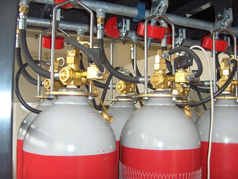 IG-100 inert gas fire suppression system cylinders aligned for clean agent discharge.