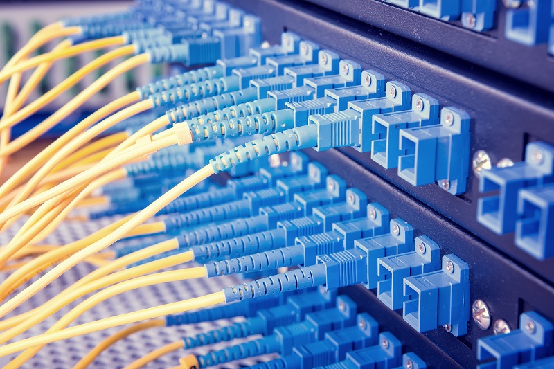 Numerous optical fiber wires mounted into patch panel for system and network integration services